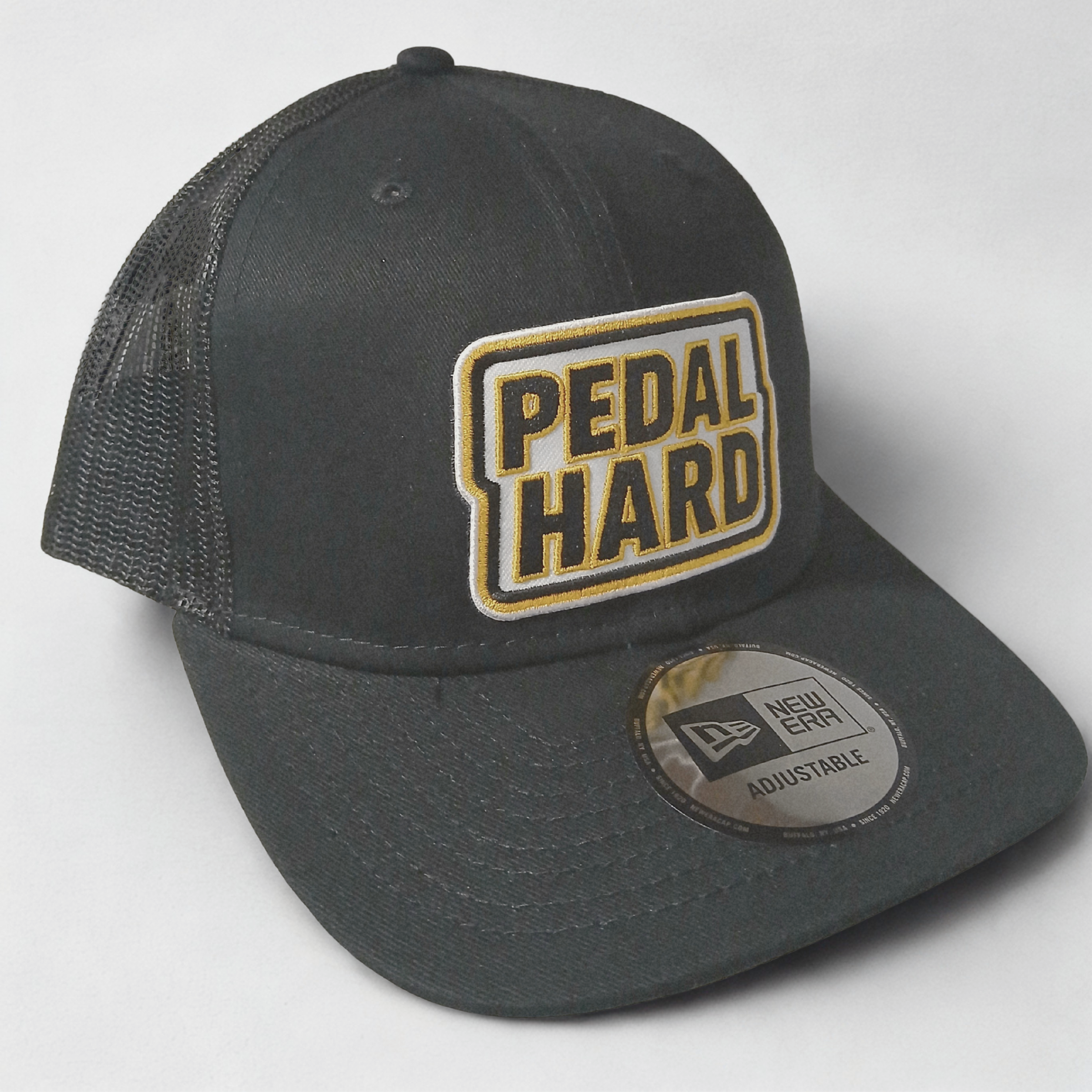 Black cap with 'Pedal Hard' logo on a white background